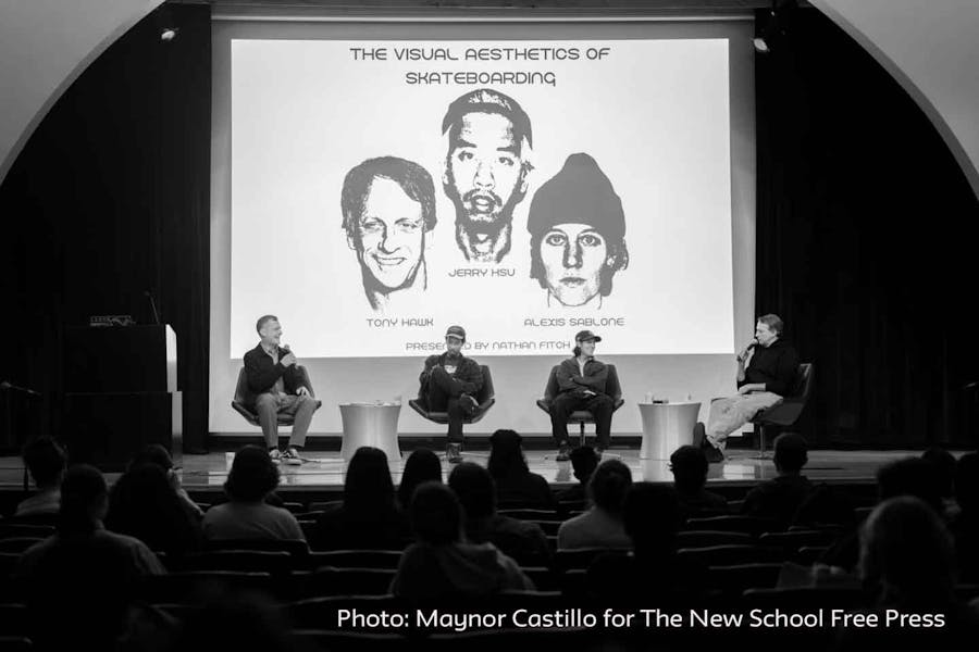 Nathan Fitch on stage with panelists Tony Hawk, Jerry Hsu, and Alexis Sablone.