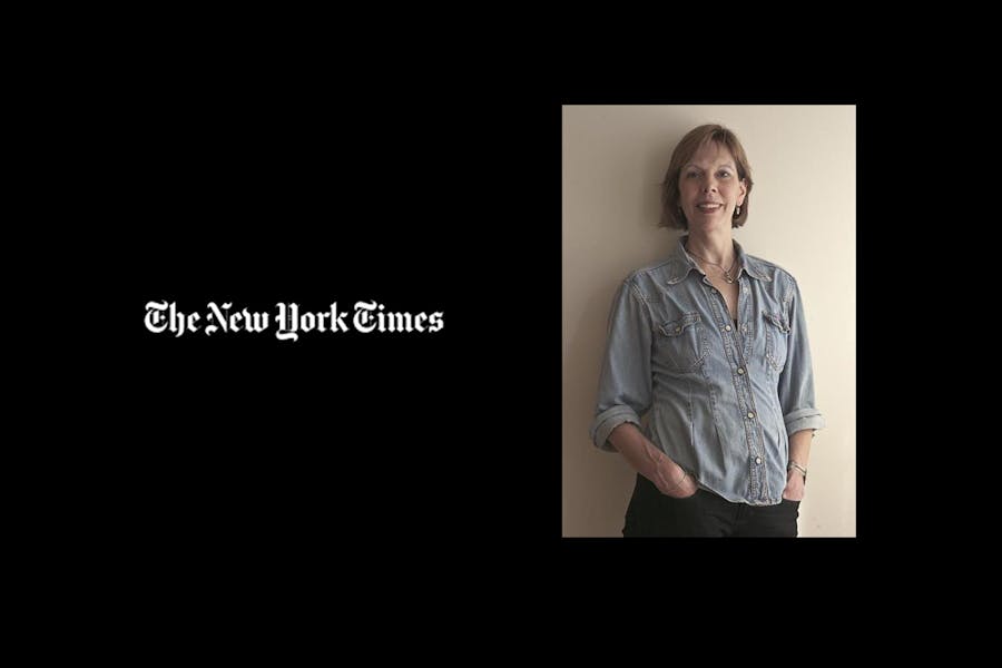 Elizabeth Kendall next to masthead of the New York Times