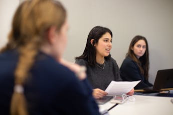 A female student speaking in class.
