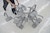 Close up of an abstract sculpture made with the backs of industrial metal chairs.