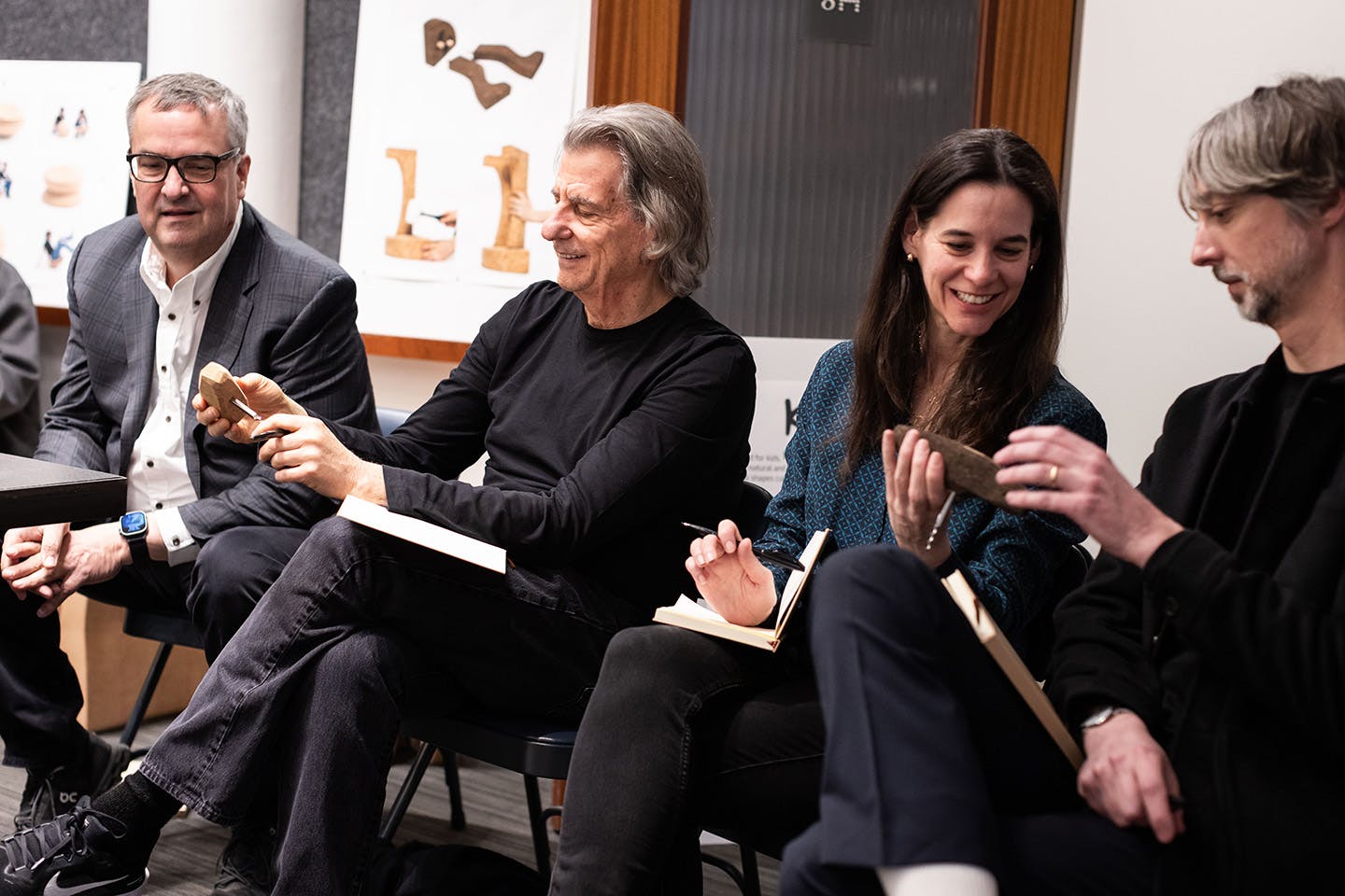 Seated from left to right, photograph of final competition judges including John McPhee, CEO of Chilewich; David Rockwell, founder of Rockwell Group who is shown holding a maquette of Aidan Murphy’s project; Annie Block, executive editor of Interior Design magazine; and Noah Schwarz, vice president of Product Design at MillerKnoll.