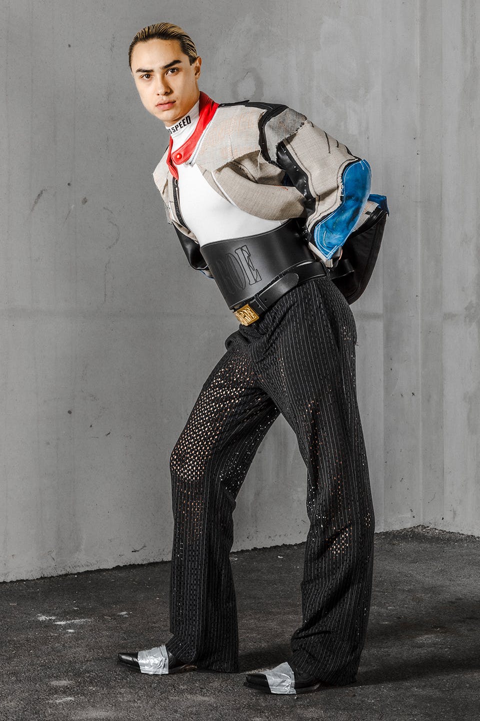Photograph of a model wearing Logan Monroe Goff’s Asphalt Cowboy look made from a repurposed leather jumpsuit.”
title=