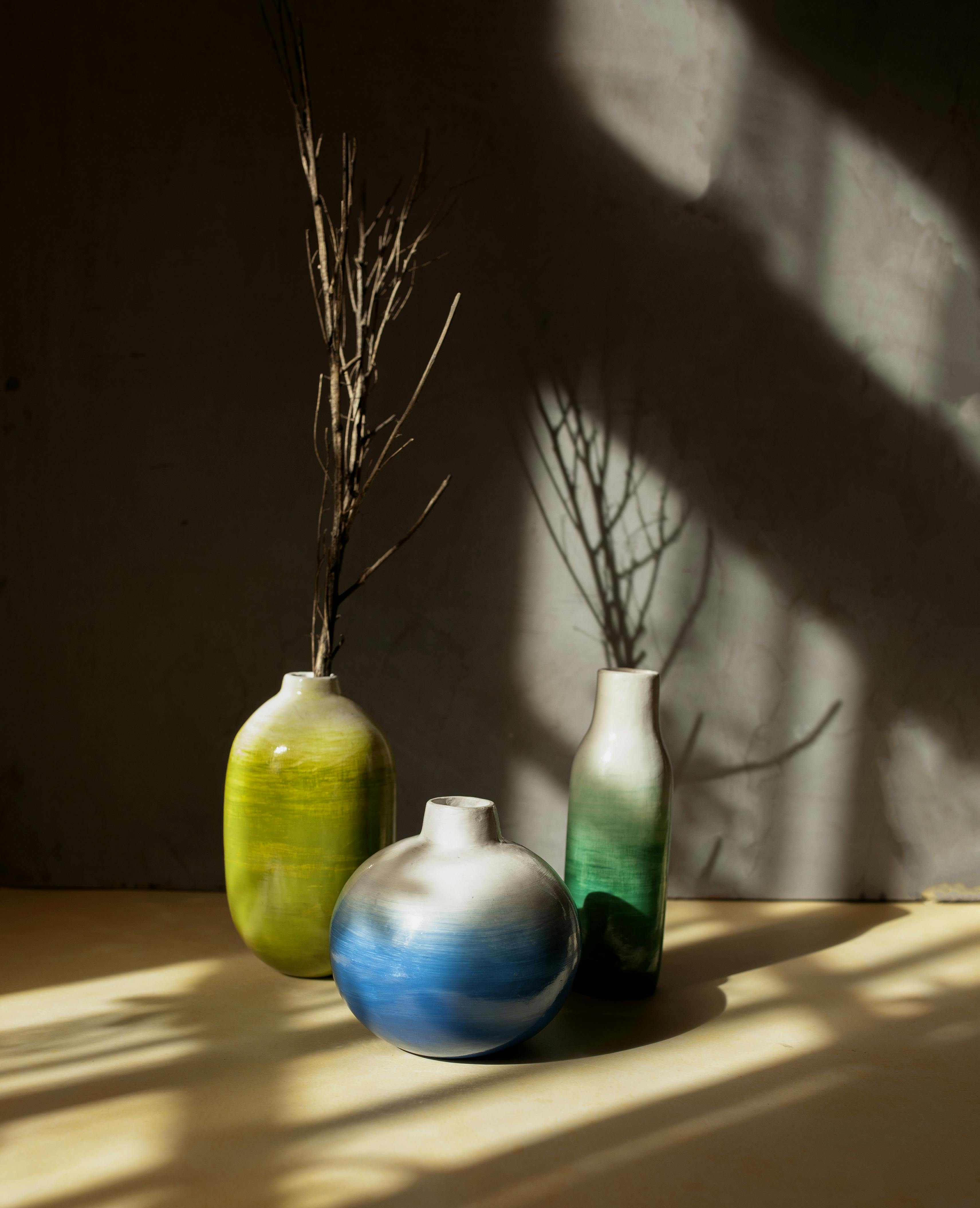 Three hand-crafted, hand-painted vases.