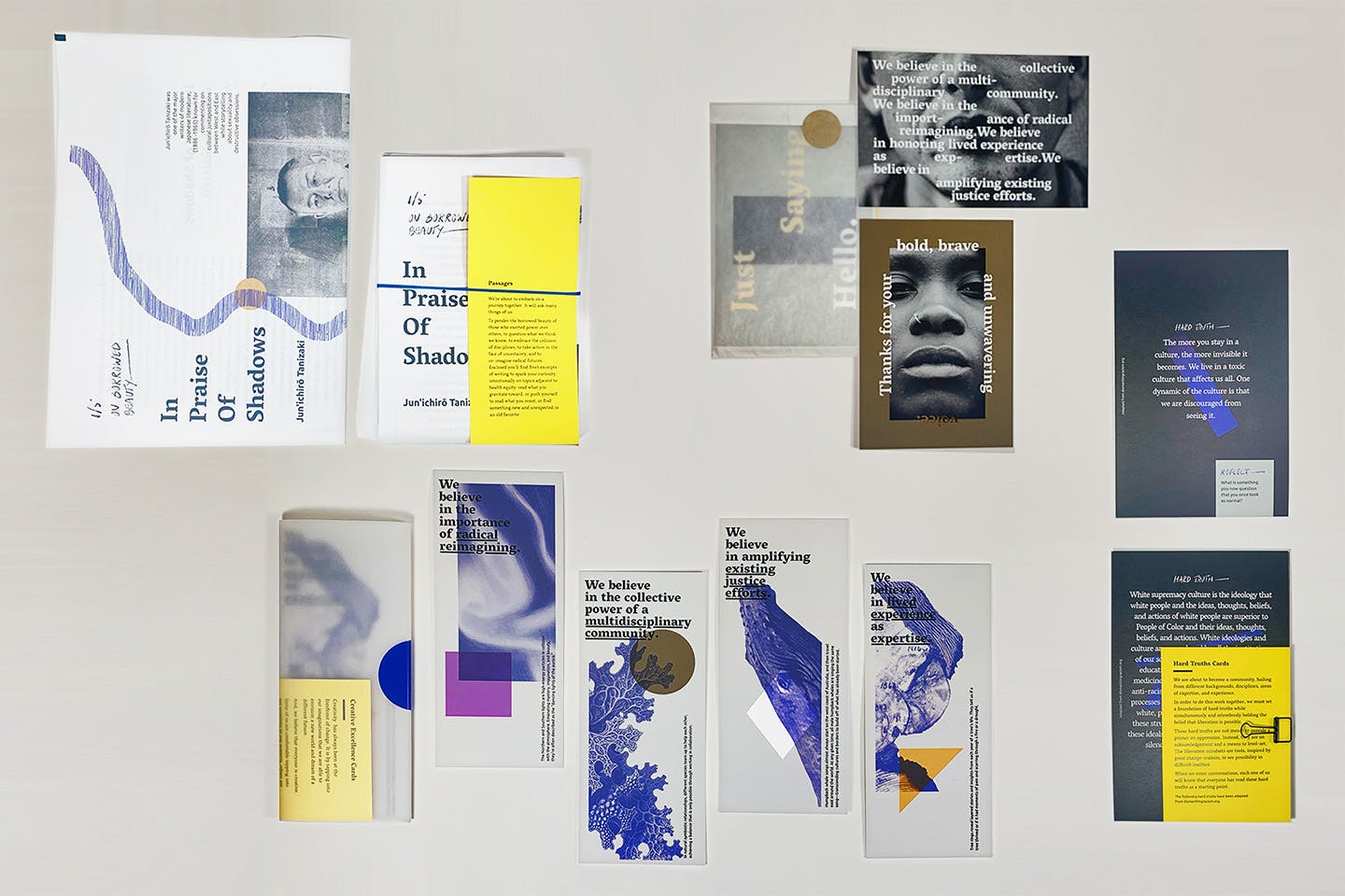 A suite of graphic brochures and posters displayed on a wall designed by IDEO.org for the Health Equity Collective.