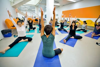 Students participate in a yoga class.