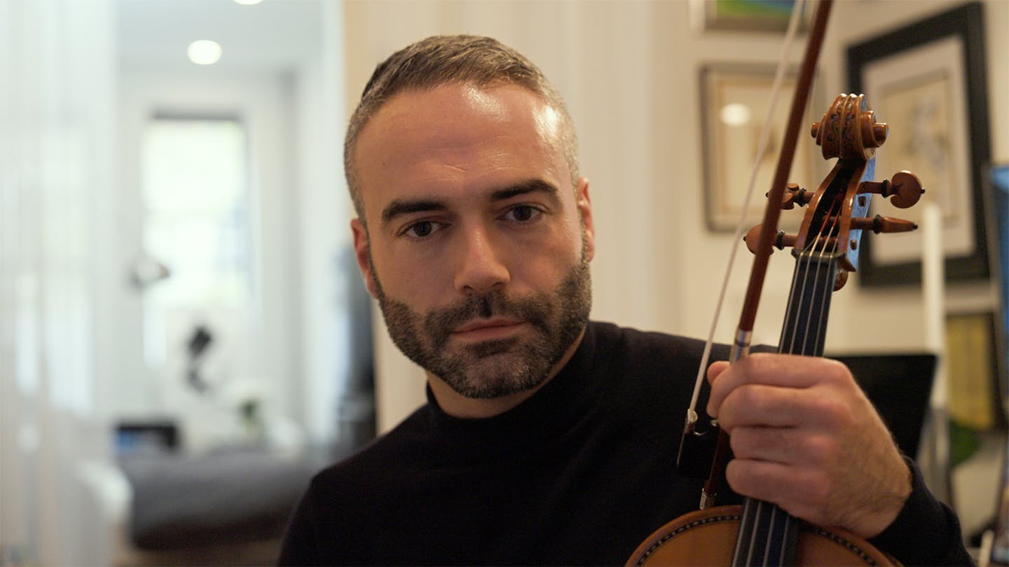 Mannes alumni Jesus Rodolfo with his violin