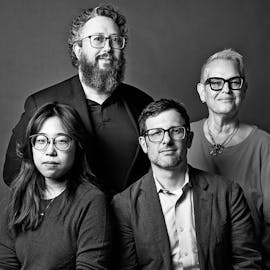 Black and white photo of four people