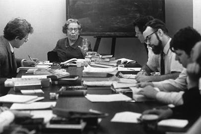 Hannah Arendt lectures to students around a table