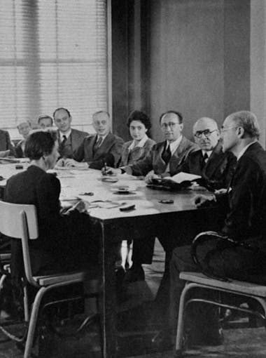 New School faculty including German scholars fleeing fascist persecution from 1933 seated around a table to start the University in Exile at The New School