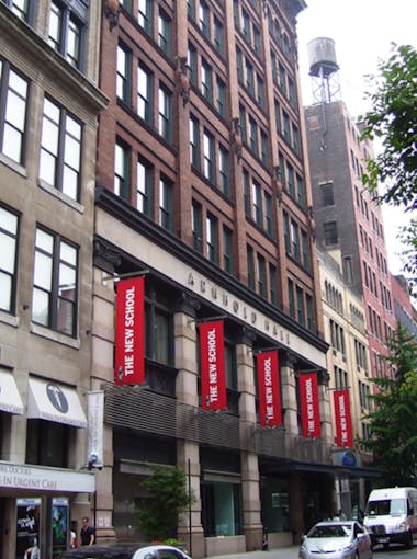 Arnhold Hall on West 13th Street with red flags reading 
