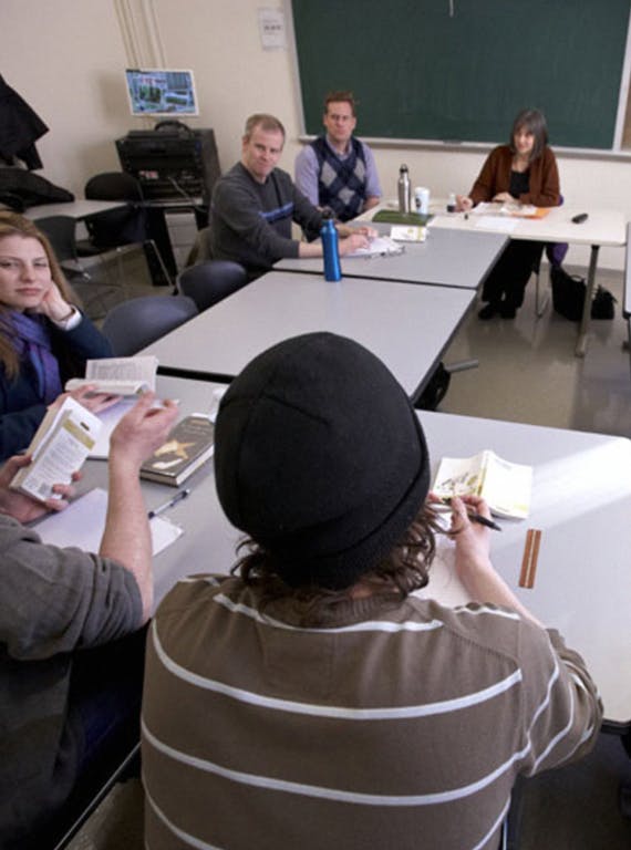 Students sitting in a classroom with a professor