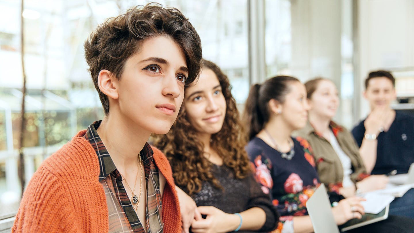 Students in a classroom looking engaged