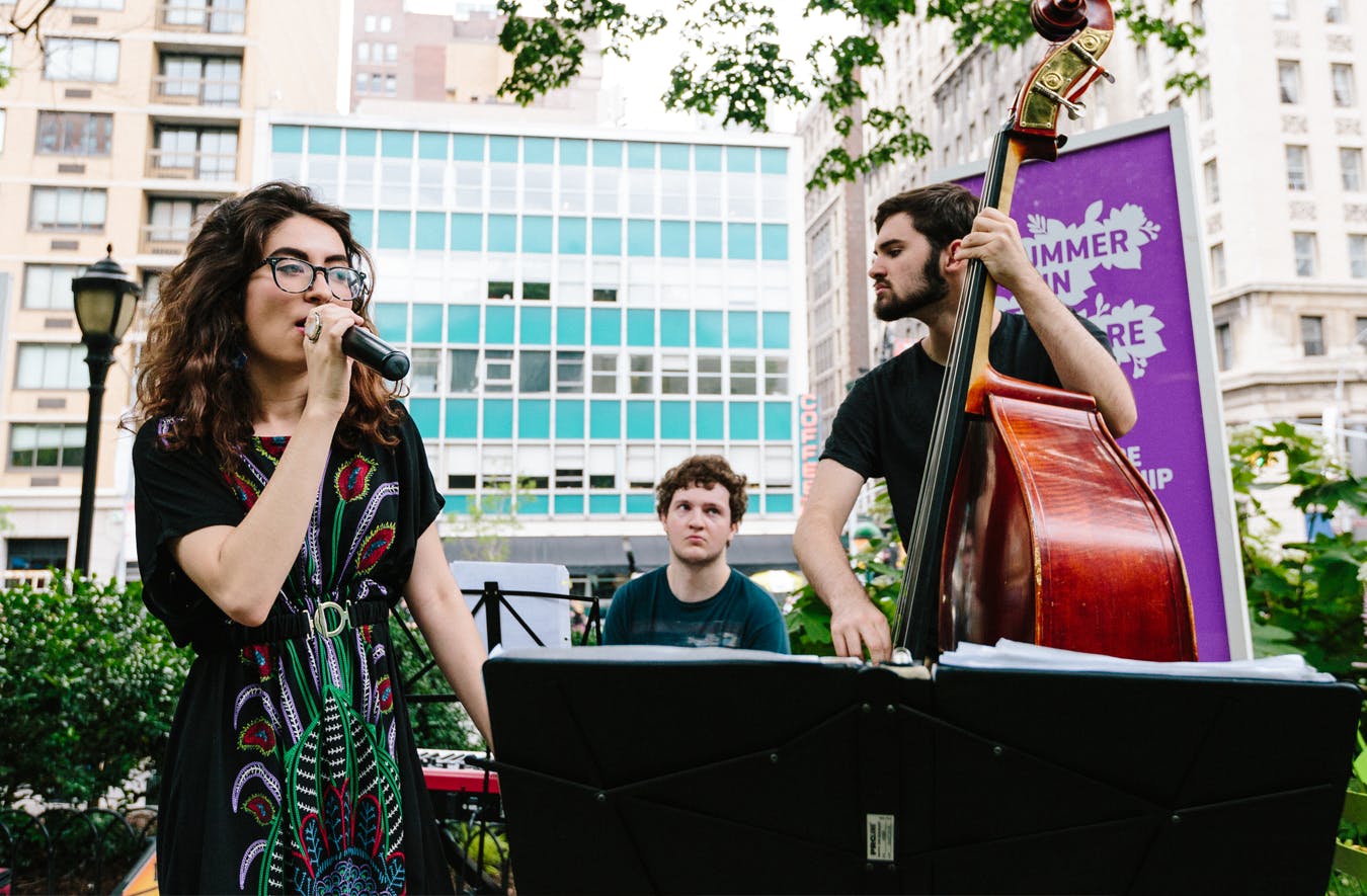 A small band performes in Union Square Park.