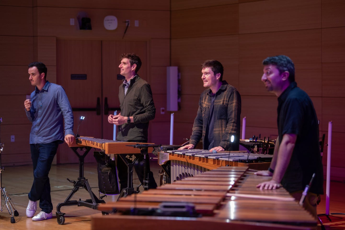 Sandbox Percussion presenting an interactive educational seminar at The New School's Tishman Auditorium.