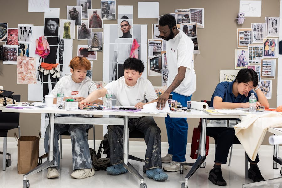 Young students working on art projects in Parsons Academy classroom