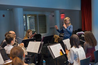 Judith Mendenhall leading rehearsal