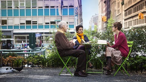 People sit around a table outside at Union Square.
